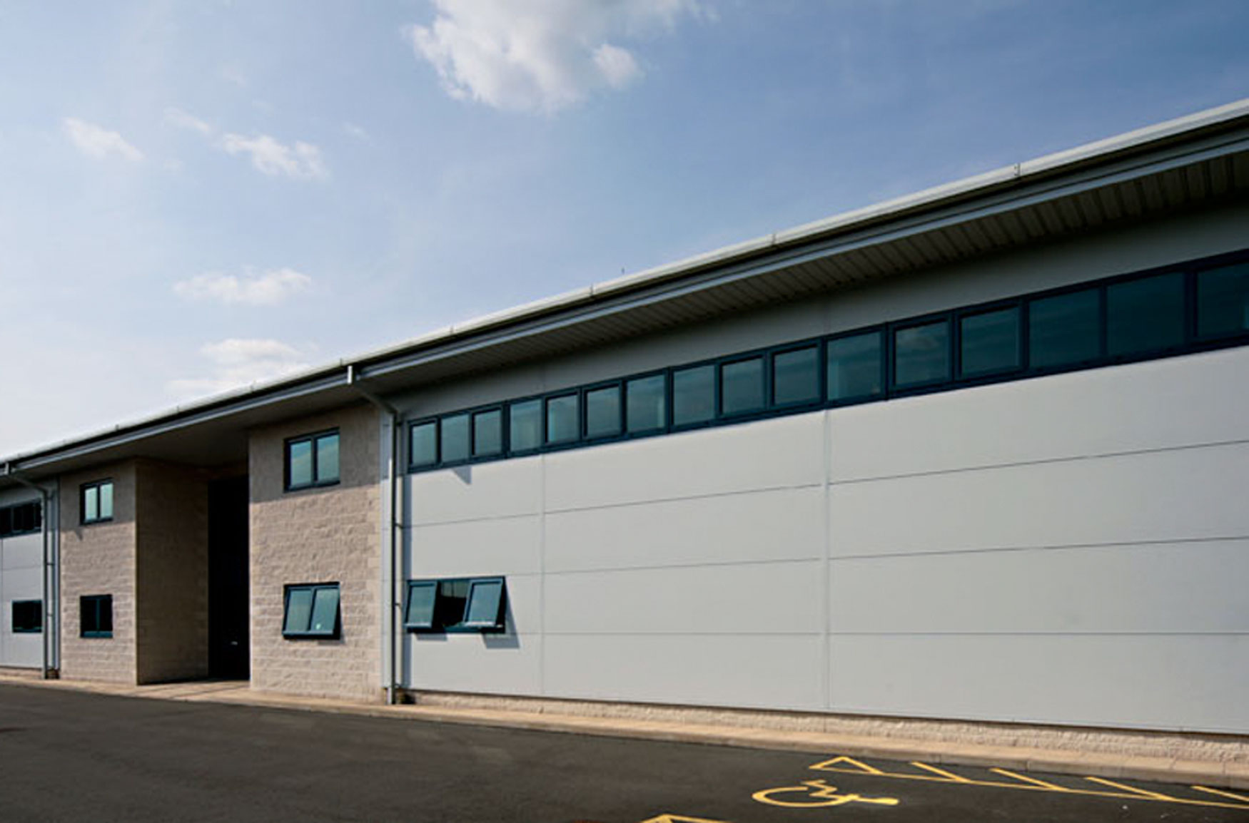 landlord and commercial office insurance, a modern contemporary exterior of factory building image