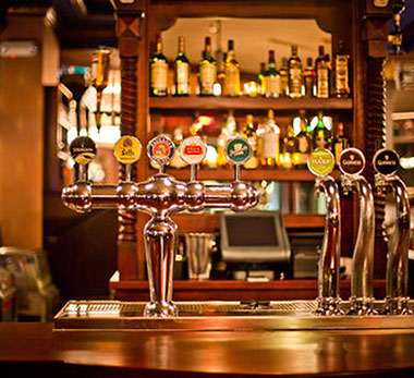 traditional pub, close-up of indoor serving counter with pumps