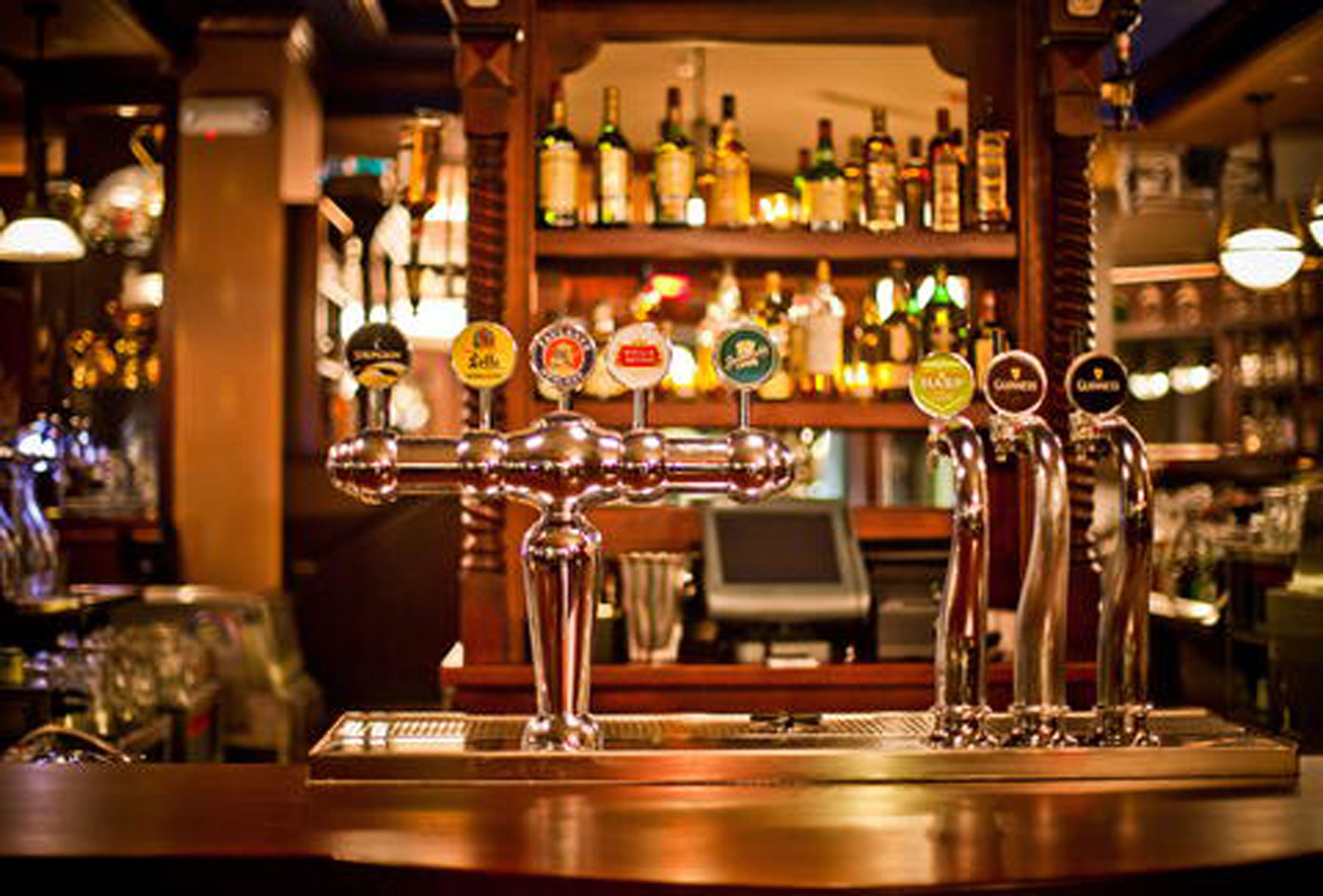 pub and shop insurance, traditional pub shown with close-up of indoor serving counter with pumps